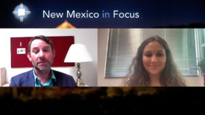 Two people engaged in a video call, with the "new mexico in focus" logo at the center top of the image.