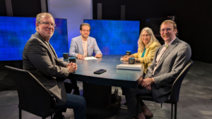 From left to right: Trip Jennings, Lou DiVizio, Dede Feldman and Daniel Williams sit at the roundtable at the KUNM station studio.