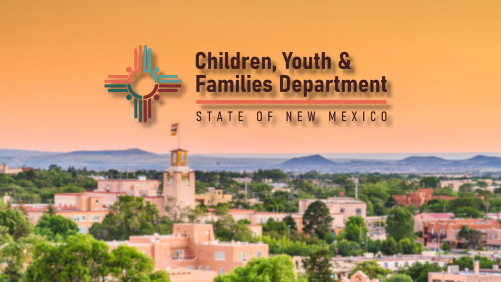 Logo of the Children, Youth & Families Department, State of New Mexico, over a blurred cityscape with southwestern-style buildings at sunset.