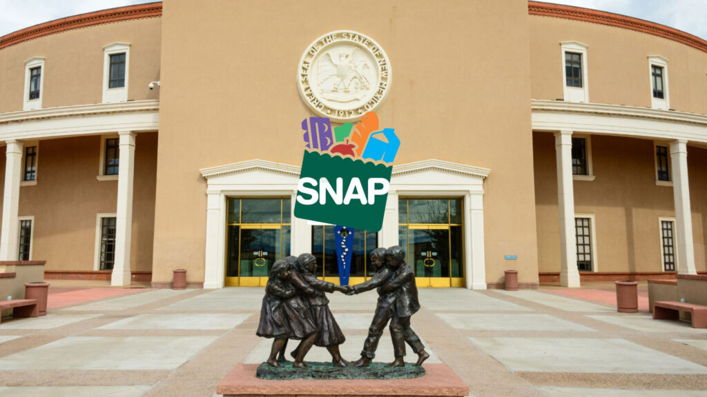 A SNAP benefits icon is superimposed over a statue of three children in front of the New Mexico State Capitol building.