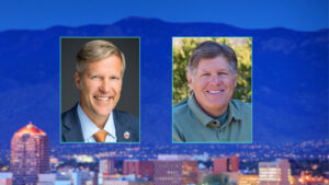 Two men are pictured in separate portrait photos, one in a suit and tie and the other in a green shirt, with a cityscape and mountains in the background.