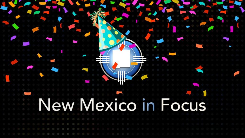 New Mexico in Focus logo with a party hat and colorful confetti on a black dotted background.