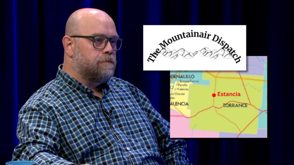 A man in glasses sits in front of a dark curtain. An overlay shows "The Mountainair Dispatch" logo and a map highlighting Estancia and nearby towns in New Mexico.