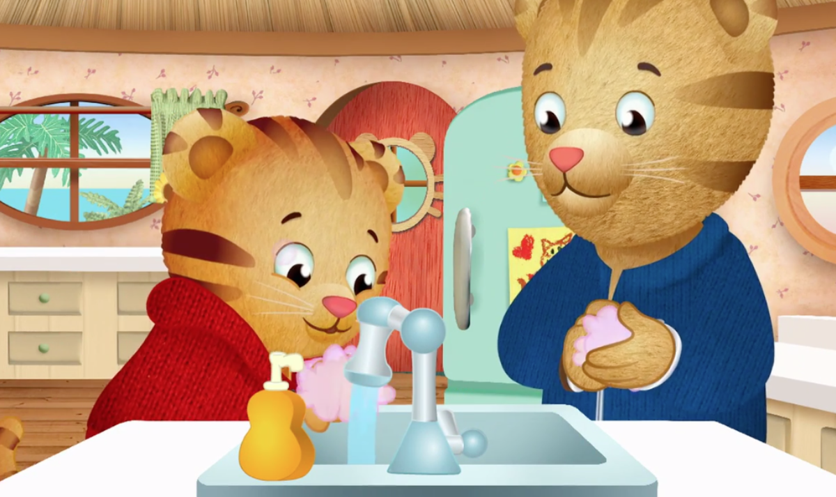 Daniel-Tiger-washing-hands Illustration of two tigers washing their hands at a sink.