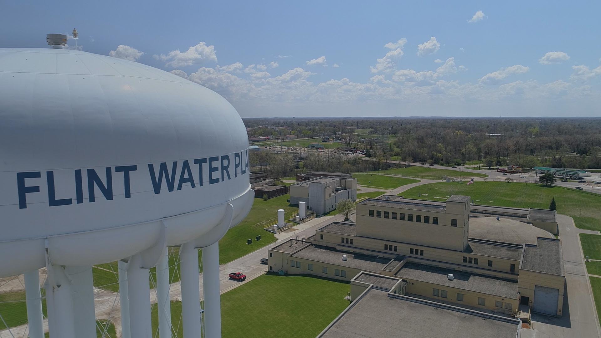 A water tower labeled "FLINT WATER PLANT".
