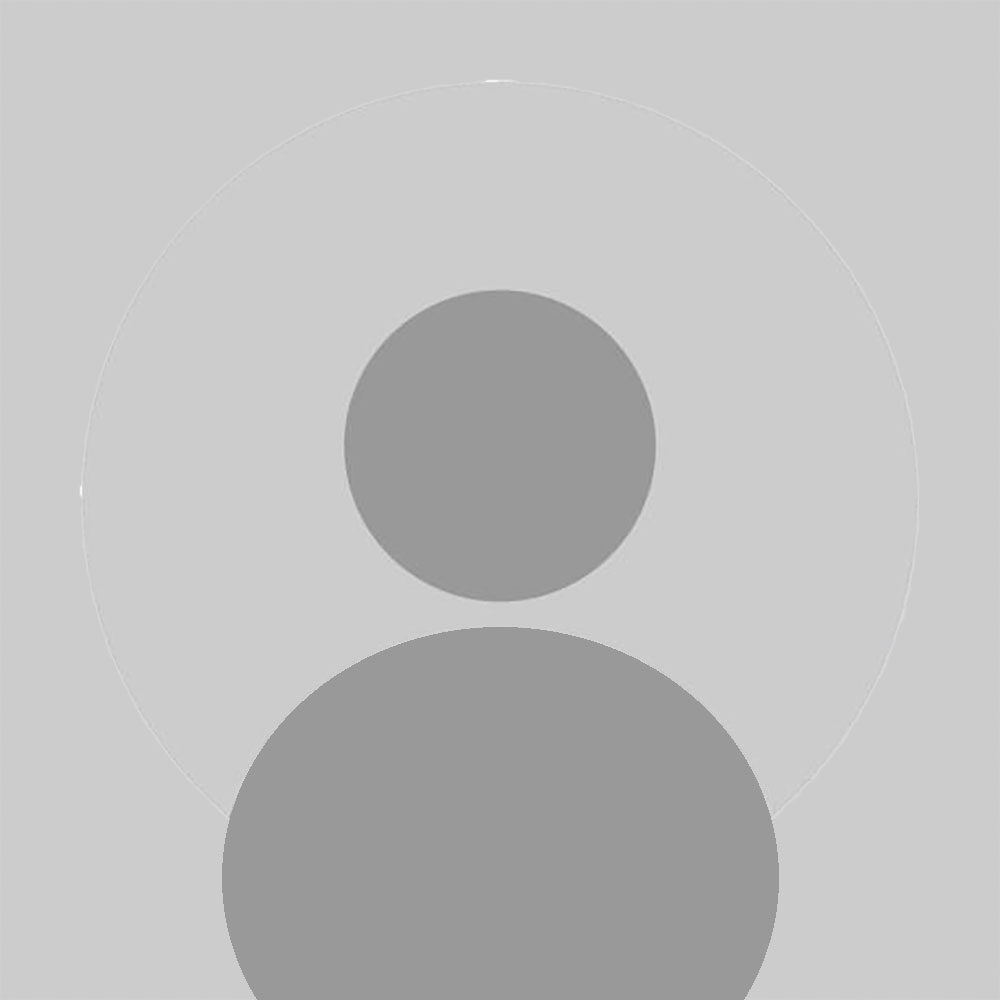Gray placeholder icon showing a large circle below a smaller circle on a light gray background, often used as a default profile image.